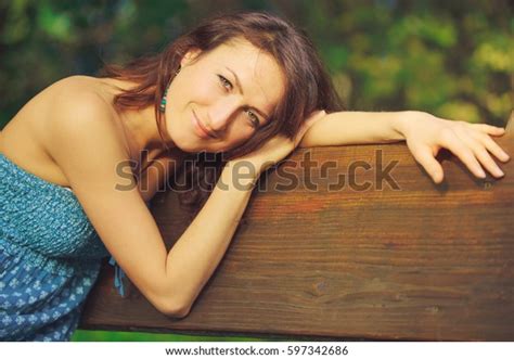 Attractive Girl Posing On Bench Wood Stock Photo Edit Now