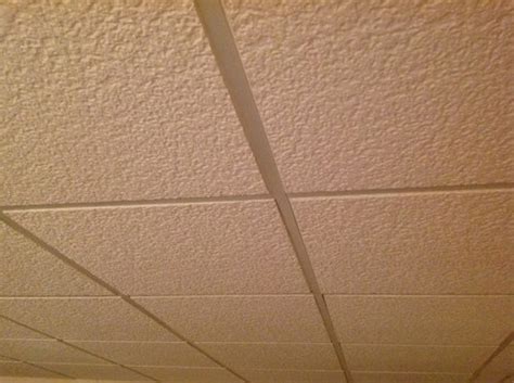Most ceiling tile should be removed rather than have another ceiling installed under it, as the old tile can deteriorate. Asbestos in ceiling tiles??