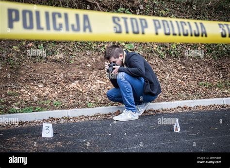 Crime scene, murder, investigation, bloody trail on asphalt, ongoing