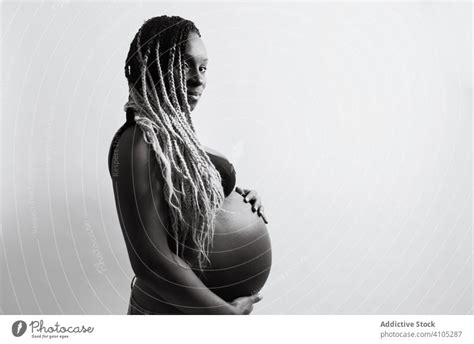 Happy African American Pregnant Woman Holding Hands On Belly A