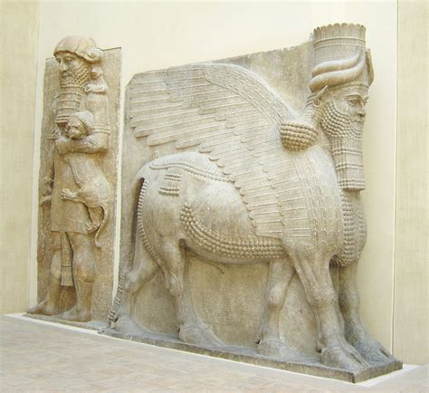 An Ancient Sculpture Is Displayed On The Side Of A Building