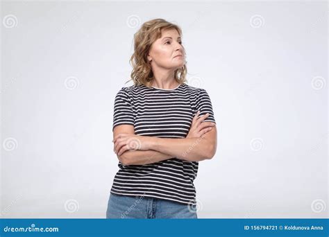 Caucasian Arrogant Mature Woman Wth Folded Hands Looking Aside Stock Image Image Of Attitude