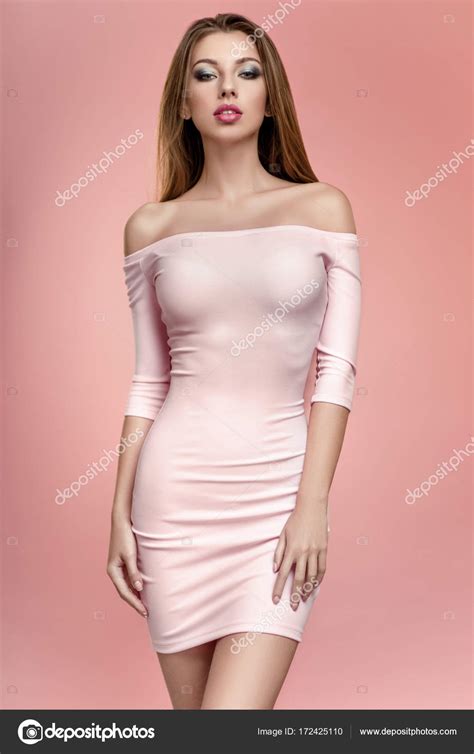 Woman In Pink Dress Posing At Camera Stock Photo By FlexDreams 172425110