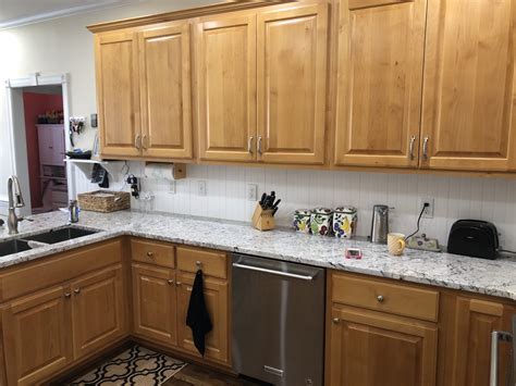 We're painting our cabinets with sw emerald urethane and will let them sit for 30 days to fully cure, but at what point can they be safely moved around? Incredible White Kitchen - 2 Cabinet Girls