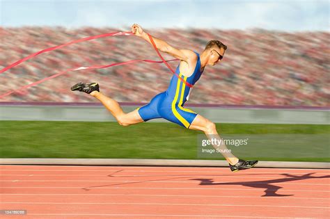 Runner Crossing The Finish Line High Res Stock Photo Getty Images