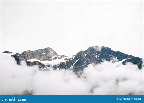 Alpine Mountain Peaks Covered By Snow And Clouds Stock Image Image Of
