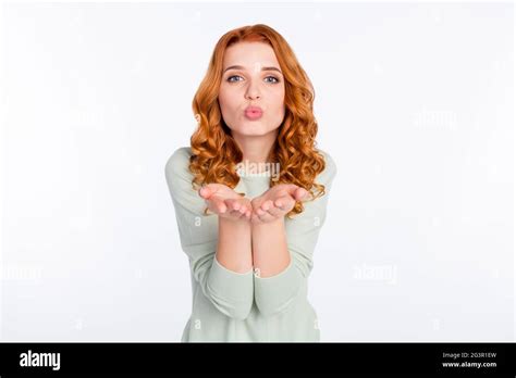 Photo Portrait Of Red Haired Girl Sending Air Kiss With Pouted Lips