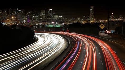 Timelapse Photo Of Road Beside Building Light Trails Road Cityscape
