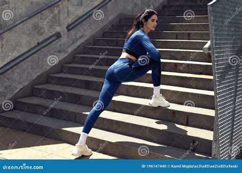 Portrait Of A Sensual Brunette Lady Doing A Stretching Stock Photo Image Of Legs Fitness