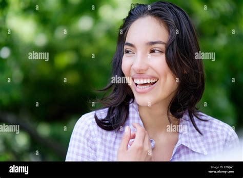 Hispanic Woman Laughing Outdoors Stock Photo Alamy