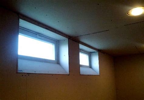 Make Windows Look Larger Angled Drywalled Basement Window Idea