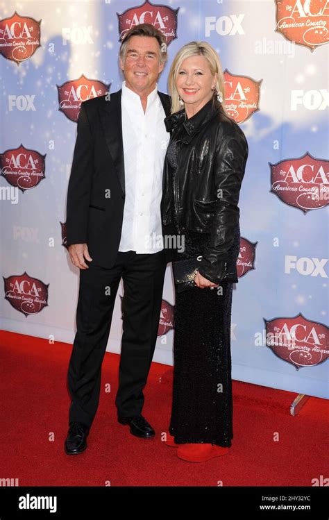 Olivia Newton John And John Easterling Attending The American Country