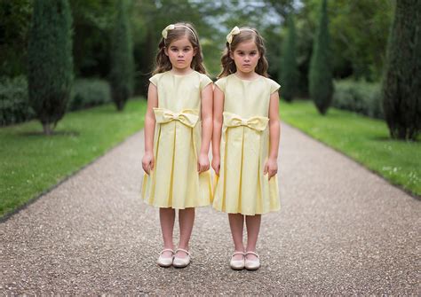 a photographer captures portraits of identical twins that show the cloud hot girl