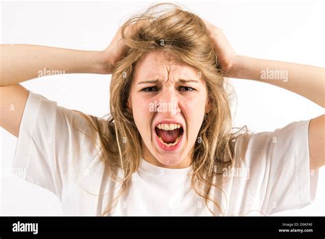 An Angry Furious Shouting Yelling Young Woman Tearing At Her Long