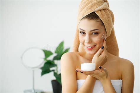 Skin Care Beauty Face Of Woman With Cosmetic Cream On Face Stock Photo