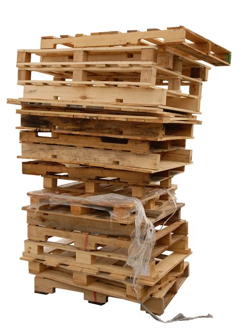Stack of wooden pallets with plastic | Mobile Pallet Service, Inc.