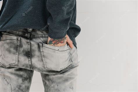 Premium Photo Tattooed Woman With Her Hand In Her Jeans Pocket