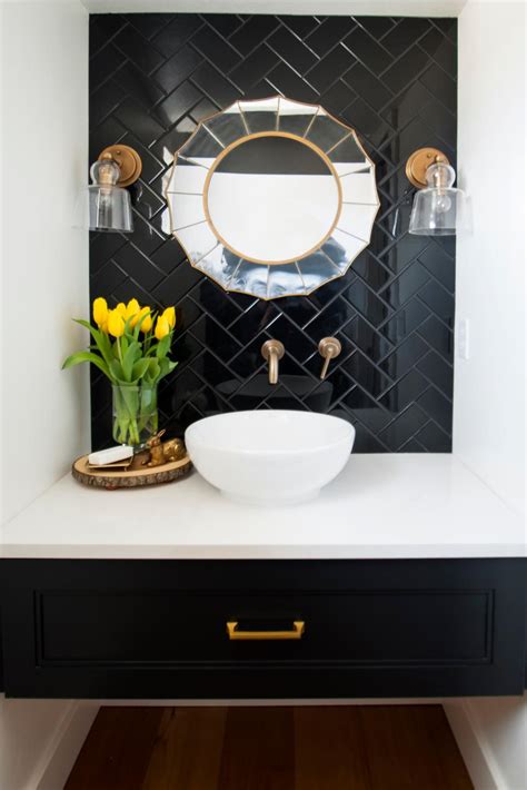 Powder Room Featuring A Black Tile Wall Art Deco Mirror