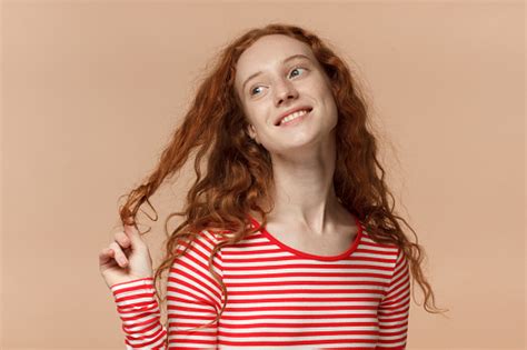 Indoor Closeup Of Young Redhead European Female Pictured Isolated On