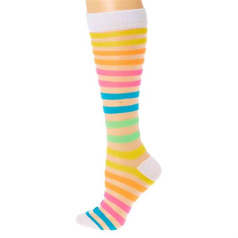 add a pop of fun color to your look with this pair of neon rainbow knee high socks the socks