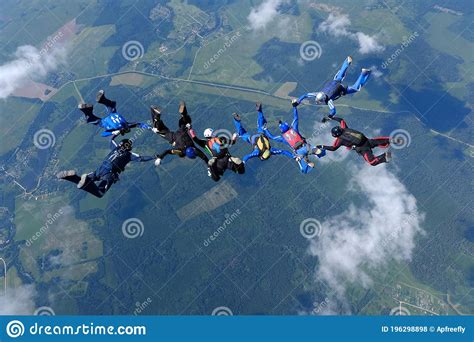 Skydiving A Skydiving Group Is Flying In The Sky Stock Photo Image
