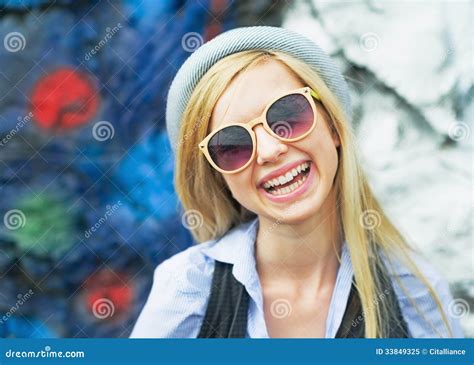 portrait of smiling hipster girl wearing sunglasses outdoors stock image image of copy happy