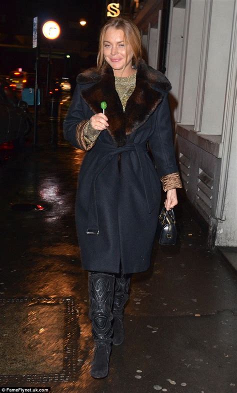 Lindsay Lohan Enjoys Lollipop As She Heads On Night Out In London