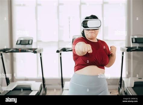 Fat Women With Vr Headset Play Visual Reality Sport Game For Exercise