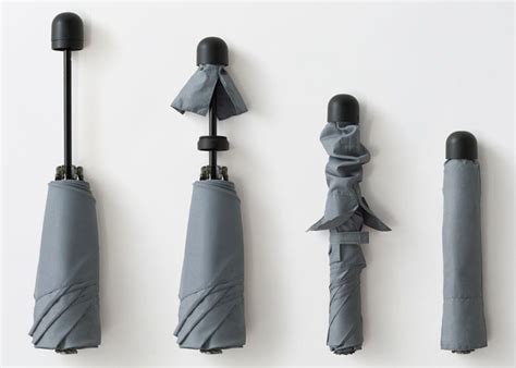 Nendos Umbrella Hides Cover In Its Handle Umbrella Cover Nendo