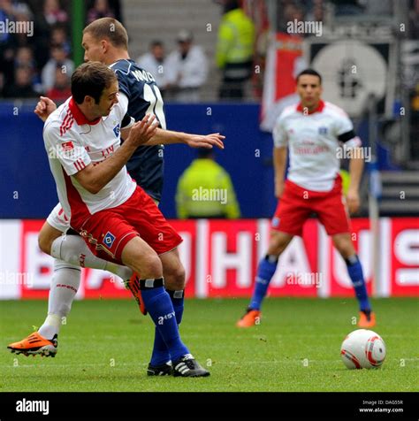 Hamburgs Joris Mathijsen Front Tackles Colognes Lukas Podolski