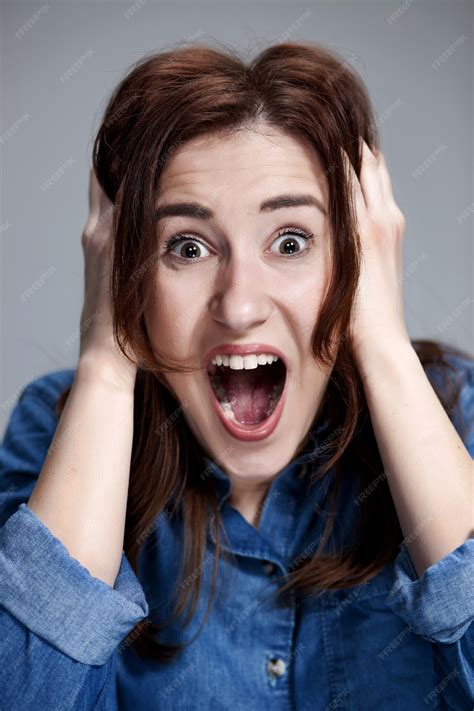 Free Photo Portrait Of Young Woman With Shocked Facial Expression