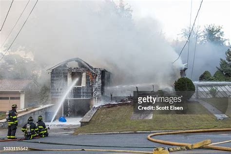 Firefighters Work To Extinguish A Fire Caused By Over Pressurized Gas