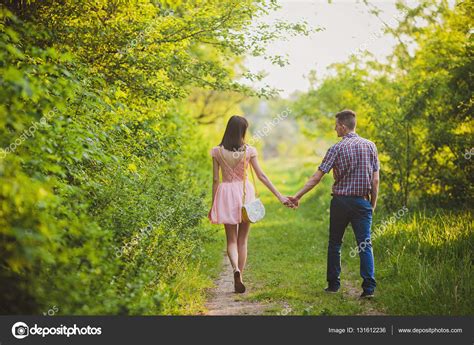 Young Couple In Love Together On Nature — Stock Photo © Saharrr 131612236