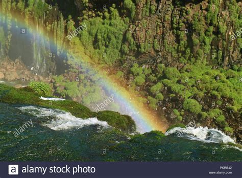 Impressive View Of A Huge Rainbow Over The Iguazu Falls Foz Do Iguacu