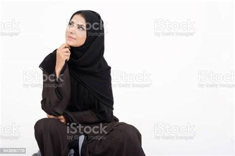 Young Pretty Arab Girl In Traditional Dress Setting On The Floor Stock