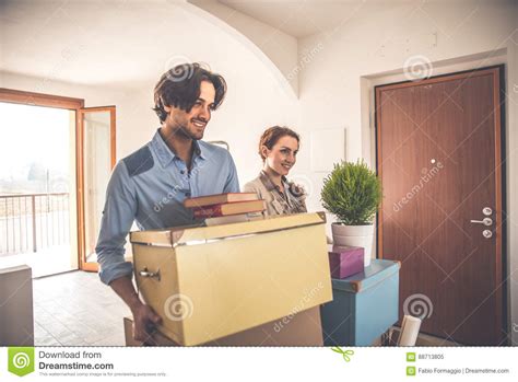 Young Couple Moving In Into New Apartment Stock Image Image Of Adult