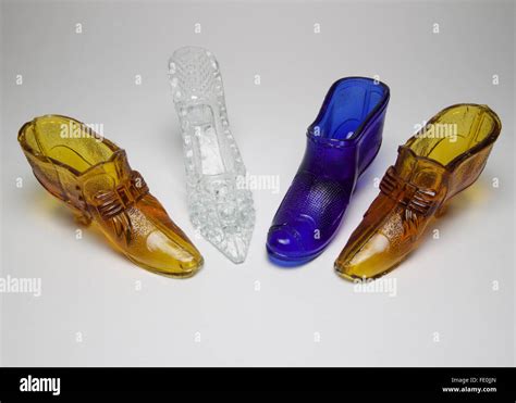4 Antique And Vintage Glass Shoes 2 Amber 1 Clear And 1 Of Bristol Blue The Largest Measures