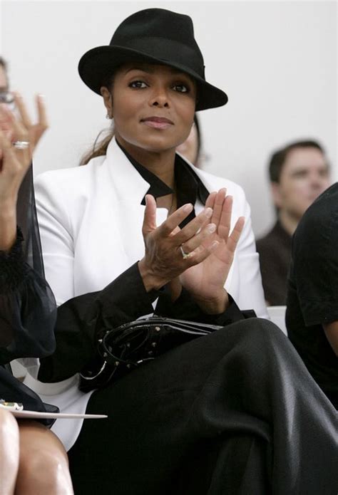 Janet Jackson Image By Cat Potier On Black And Wearing A Hat And A Wrap