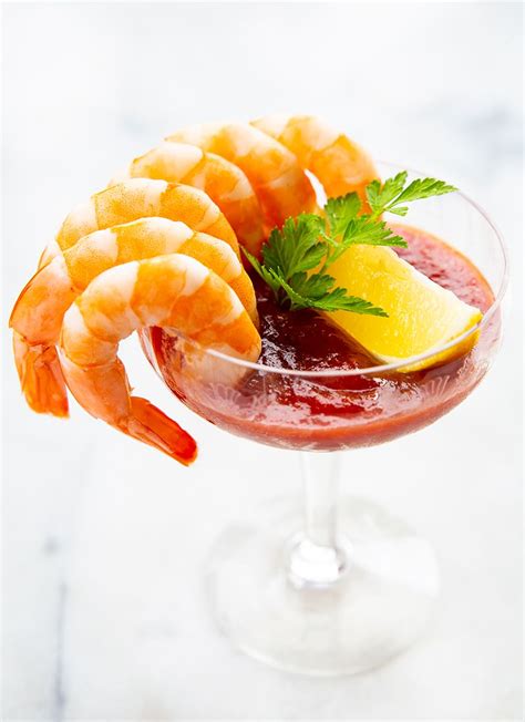 Arrange your shrimp on an oven tray, on a single layer. Cooked, cold shrimp served in a coupe or martini glass ...