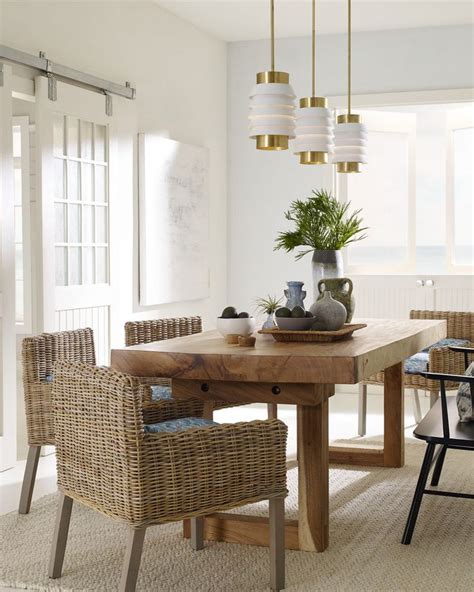This coastal dining room features the designer Onshore ...