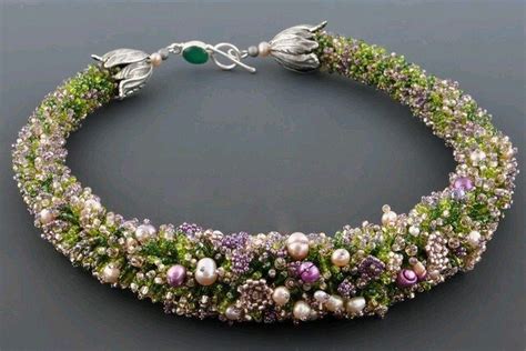 A Bracelet With Pearls And Green Beads