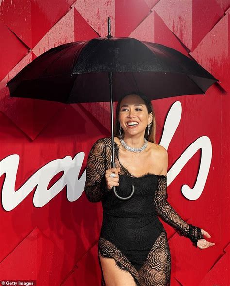 myleene klass flaunts her jaw dropping figure in a very racy sheer gown as she braves the rain