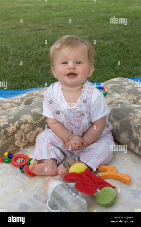 6 Month Old Baby Holly Sitting Up And Smiling Stock Photo Alamy