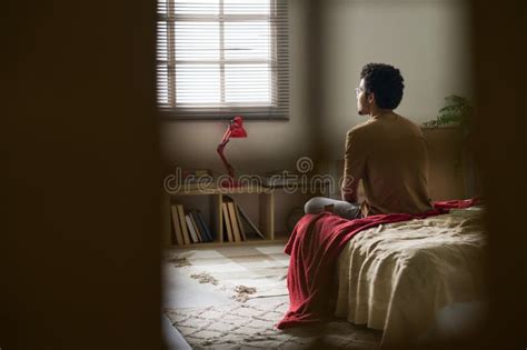 Teenage Boy Sitting Alone In His Bedroom Stock Photo Image Of