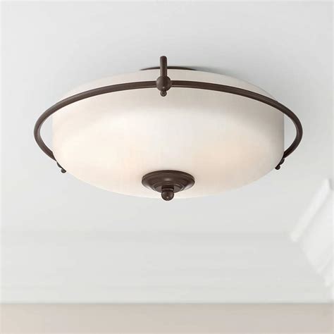 Falls between a flush mount fixture and a chandelier in style. Quoizel Griffin Large Bronze Floating Ceiling Light ...