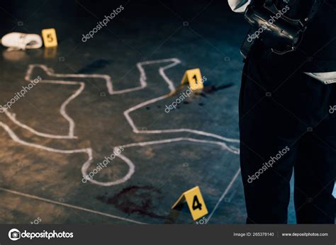 Cropped View Investigator Standing Chalk Outline Evidence Markers Crime