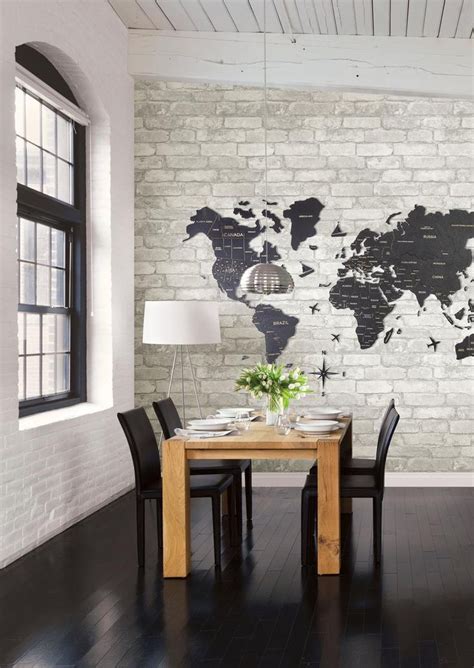 A Dining Room Table With Chairs And A World Map On The Wall