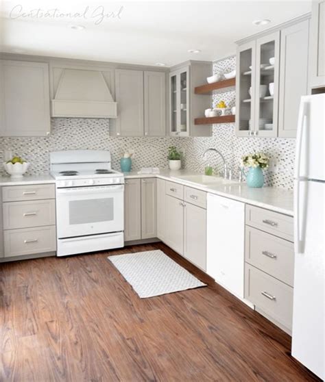 A white kitchen cabinet can offer more counter space or additional shelving for essentials like pots and pans. Centsational Girl used Formica Carrara Bianco in Ideal ...