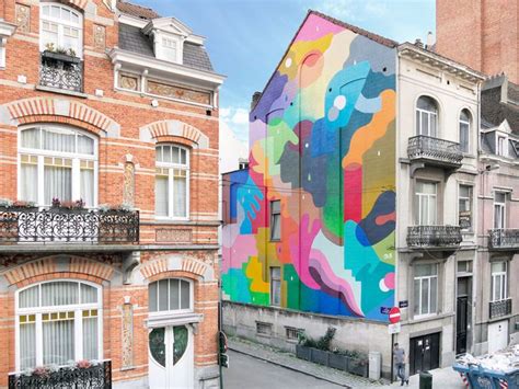 Interlocking Pools Of Color Swirl Across Building Facades In Bright
