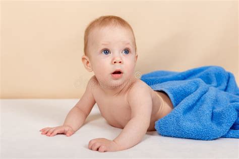 Adorable Baby Boy Lying Under The Towel And Having Fun After Bath Stock
